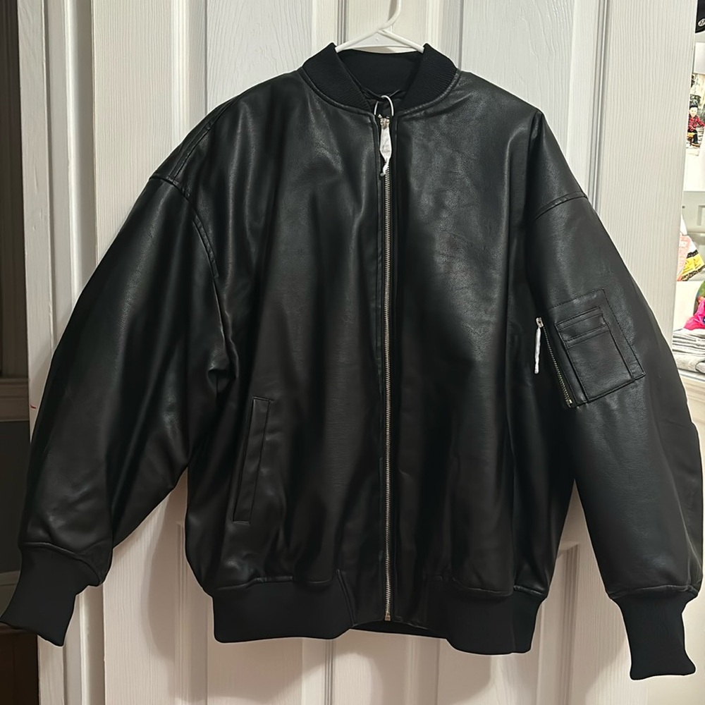 Super cute leather jacket for sale. New with tags. More on the oversized side.